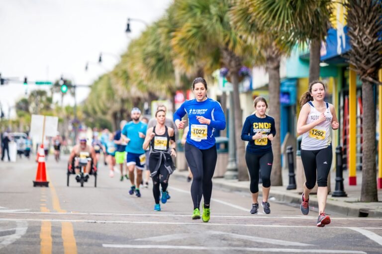 Runners in a local 5K road race on a city street