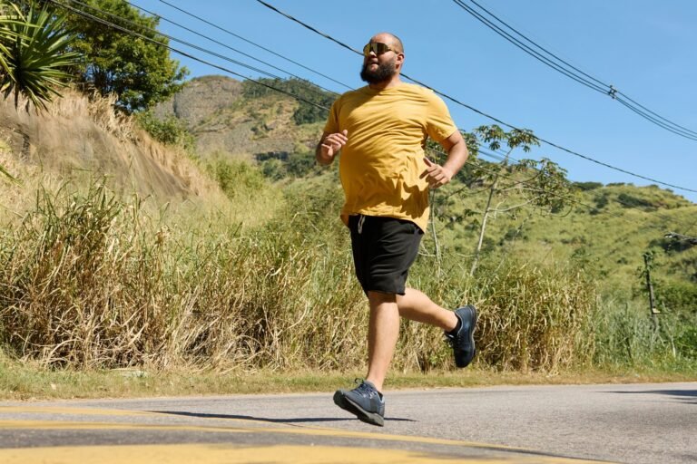 Runner on a road showing upright posture and relaxed running form