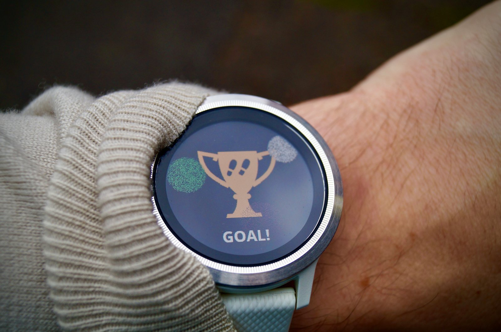 A GPS running watch showing a completed goal